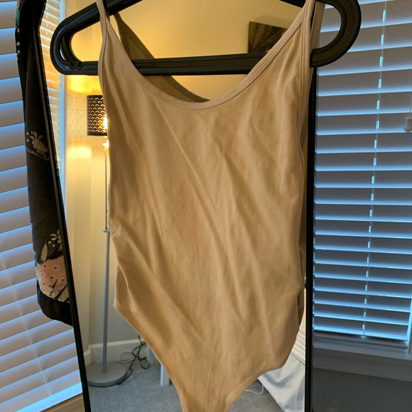 TNA Tops - TNA thong body suit size medium beige